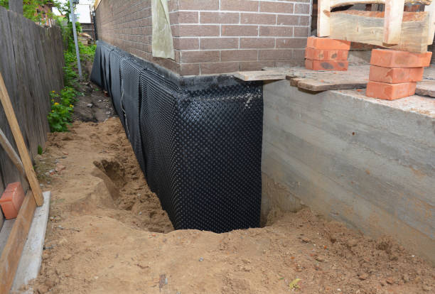 Happy homeowners after waterproofing job in Rockville Centre